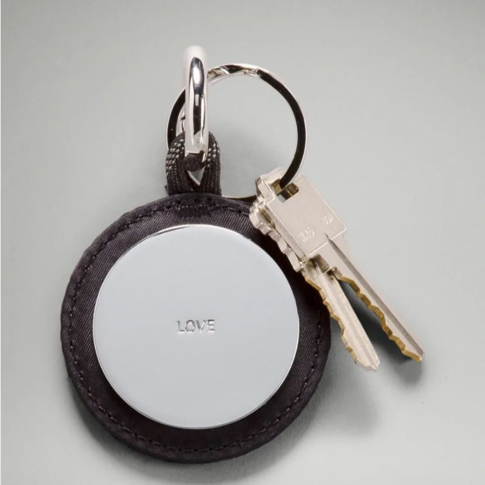 NWT Lululemon Keychain Large. Black/Silver reflection mirror. Good weight